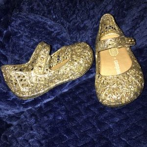 These are gold sparkle lace Mini Melissa's